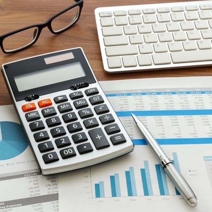 Close up of a calculator and financial documents